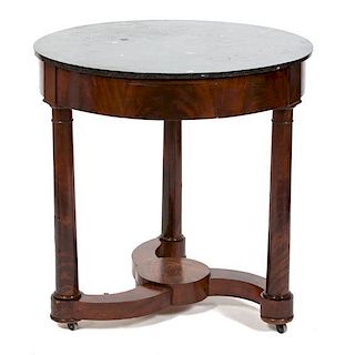 An Austrian Biedermeier Mahogany Side Table Height 29 x diameter 29 inches.