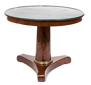 An Austrian Biedermeier Mahogany Table Height 28 3/4 x diameter 38 3/4 inches.