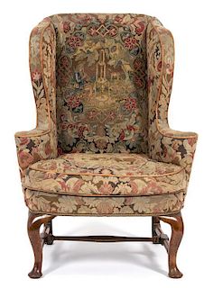 A Queen Anne Needlepoint Upholstered Walnut Wing Chair Height 47 inches.