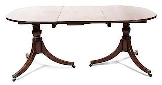 A Regency Mahogany Double-Pedestal Dining Table Height 30 x length extended 79 x depth 48 inches.