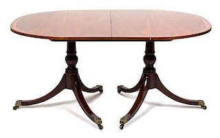A Regency Style Mahogany Two Pedestal Dining Table Height 28 1/2 inches x length 60 x depth 42 inches.