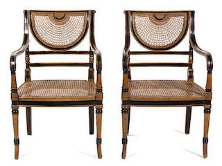 A Regency Style Mahogany and Ebonized Cane-Back and Seat Armchair Height 36 inches.
