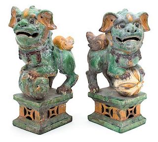 A Pair of Chinese Polychrome Glazed Ceramic Foo Dogs Height 14 1/2 inches.