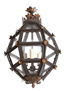 A Patinated and Pierced Metal Hanging Lantern Height 22 inches.