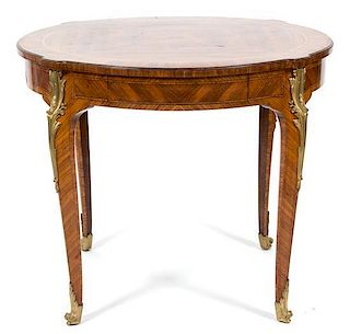 A Louis XV Style Gilt Bronze Mounted Rosewood Center Table Height 30 x diameter 35 inches.