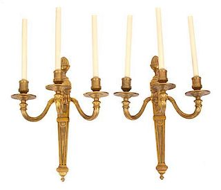 A Group of Four Louis Philippe Style Gilt Bronze Three-Light Wall Sconces Height 21 inches.