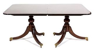 A Regency Style Mahogany Double Pedestal Extension Table Height 28 1/2 x width 48 x length 66 inches (without leaves).