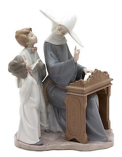 A Lladro Porcelain Figural Group Height 12 3/4 inches.