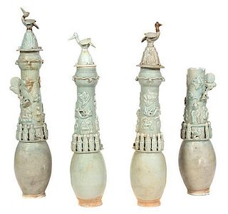 A Group of Four Chinese Celadon Glazed Funerary Urns Height of tallest 32 inches.