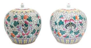 A Pair of Chinese Famille Rose Porcelain Covered Jars Height 9 x diameter 8 inches.