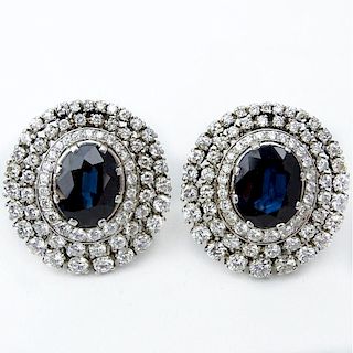 Approx. 12.0 Carat Oval Cut Sapphire, 7.50 Carat Round Brilliant Cut Diamond and Platinum Earrings.