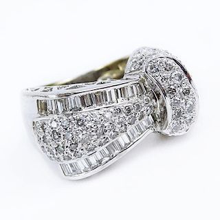 Round Brilliant Cut and Baguette Diamond and 18 Karat White Gold Ring.