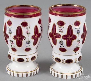 Two Bohemian glass opaque cut to ruby glasses, ca. 1900, 5 1/2'' h. and 5 5/8'' h.