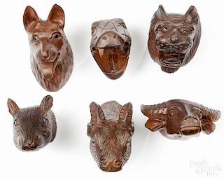 Six Tai carved wood animal heads, mid 20th c., longest - 7''.