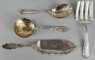Four sterling silver serving utensils, 12.8 ozt.