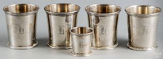 Set of four sterling silver julep cups, by New Orleans Silversmiths, dated 1950, 2 7/8'' h.