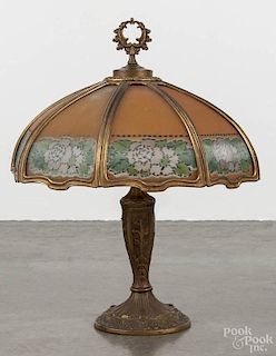 Reverse painted glass and spelter table lamp, early 20th c., with a floral ribbed glass shade