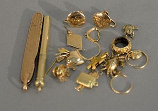Gold lot to include kife, pencil, charms, buttons, etc. 37.5 grams