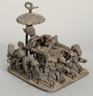 African bronze of tribesmen carrying a man. ht. 6in., lg. 6 1/4in., wd. 5in.