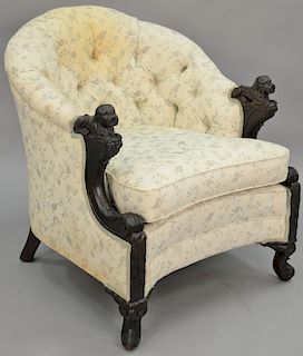 Carved walnut armchair, fully upholstered with carved dog hand rests (upholstery stained). ht. 34in. Provenance: Property fro