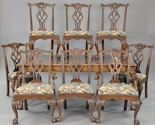 Henredon mahogany Chippendale style table with two 22 inch leaves and pads along with eight Chippendale style dining chairs.