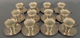 Twelve sterling silver demitasse cups and saucers with Lenox inserts, one insert non matching. height of cup without liner: h