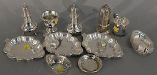 Sterling silver lot to include a pair of salt and peppers, 12 matching salts, shaker, and three leaf dishes. 25.8 t oz.