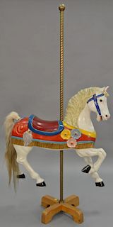 Carousel style horse with brass post, circa 1988 (one ear chipped). total height 67in., wd. 33in. Provenance: Property from t