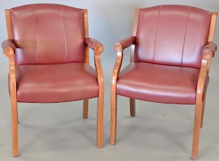 Pair of vinyl upholstered armchairs.
