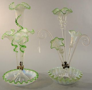 Two Victorian glass epergnes, one with ruffle rim bowl supporting three vases and two twist canes, the other with four ruffle