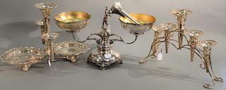 Three silverplate epergnes to include a silverplate epergne with two bowls and central putti supported by winged women, botto