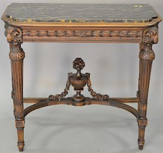Louis XVI style marble top table with ram's heads. ht. 33in., top: 18 1/2" x 38" Provenance: Property from the Estate of Fran