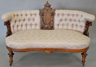 Eastlake Victorian walnut settee with tufted upholstered back. ht. 35 1/2in., wd. 56in. Provenance: Property from the Estate