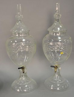 Pair of crystal urns marked brandy and whisky with spigots. ht. 31in. Provenance: Property from the Estate of Frank Perrotti