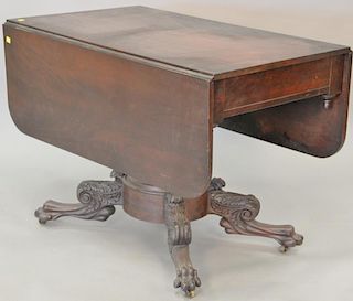 Federal mahogany drop leaf table with paw feet, circa 1840, ht. 29in., top closed: 23 1/2" x 40"