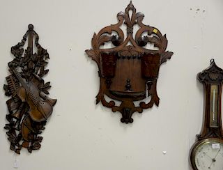 Three carved wall hangings including carved walnut hanging tobacco cigar box (ht. 28in.), musical motif having violin, flutes