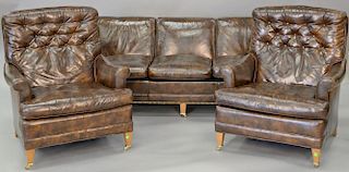 Two piece lot to include a pair of Loeblein leather easy chairs and Loeblein leather sofa (wd. 75in.)