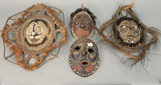 Group of four turtle shell African masks. ht. 10in. to 21in.