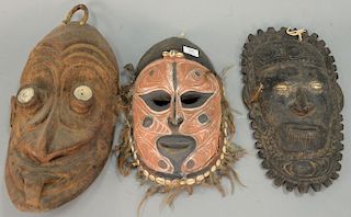 Group of three large wooden African masks. ht. 15in., 17 1/2in., & 19 1/2in.