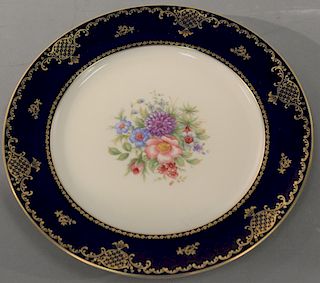 Twelve Rosenthal Ivor porcelain dinner plates with gold and dark blue border. dia. 11in.