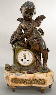 Victorian cast metal figural clock with winged putti figure and birds over clock on marble base. ht. 21in., wd. 12in. Provena