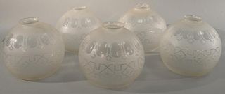 set of five frosted etched glass globe shades. ht. 7 1/4in., dia. 5 1/2in.