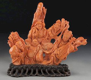 Large Chinese carved coral figure on wood base