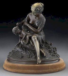 Patinated bronze depicting a woman and cherub,