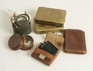 British and German WWI and WWII goggles, boxes, compasses, cigar case, and more