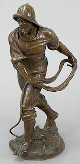 Bronze sculpture of a sailor with an anchor,
