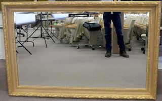 Large gold framed mirror. 44 1/2" x 68"