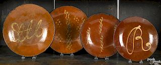 Four redware plates, 19th c.