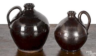 Two Pennsylvania ovoid redware jugs, 19th c.