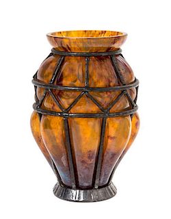 A Daum Blown-Out Glass and Louis Majorelle Iron Mounted Vase, Height 7 1/4 inches.